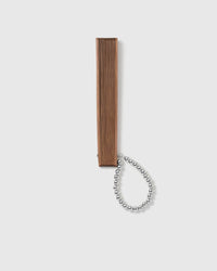 Brown all-bamboo folding hand fan with silver beaded loop charm
