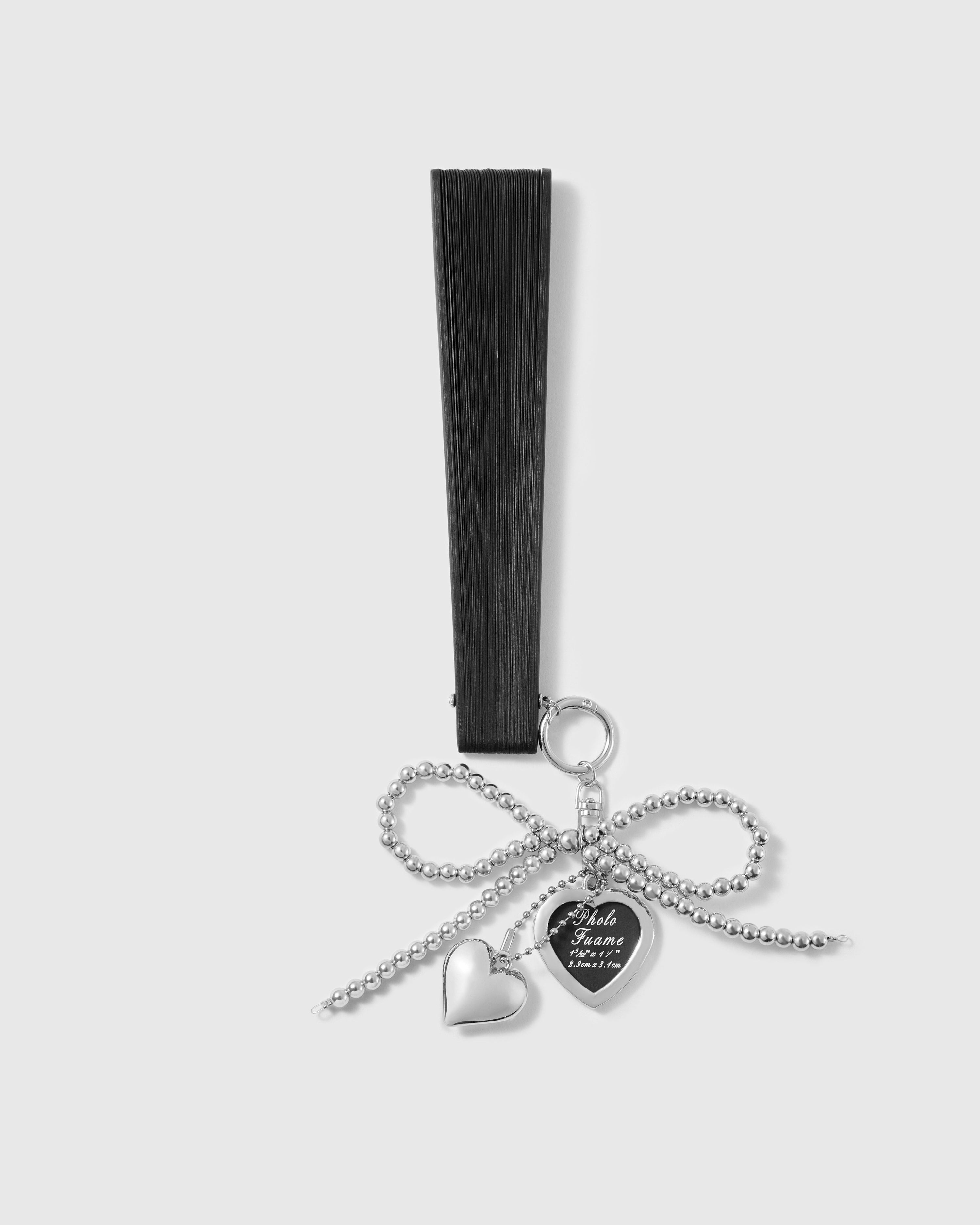 Black all-bamboo folding hand fan with beaded bow photo locket charm