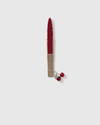 Closed garnet STICKYZOO shell-shaped hand fan with cherry charm