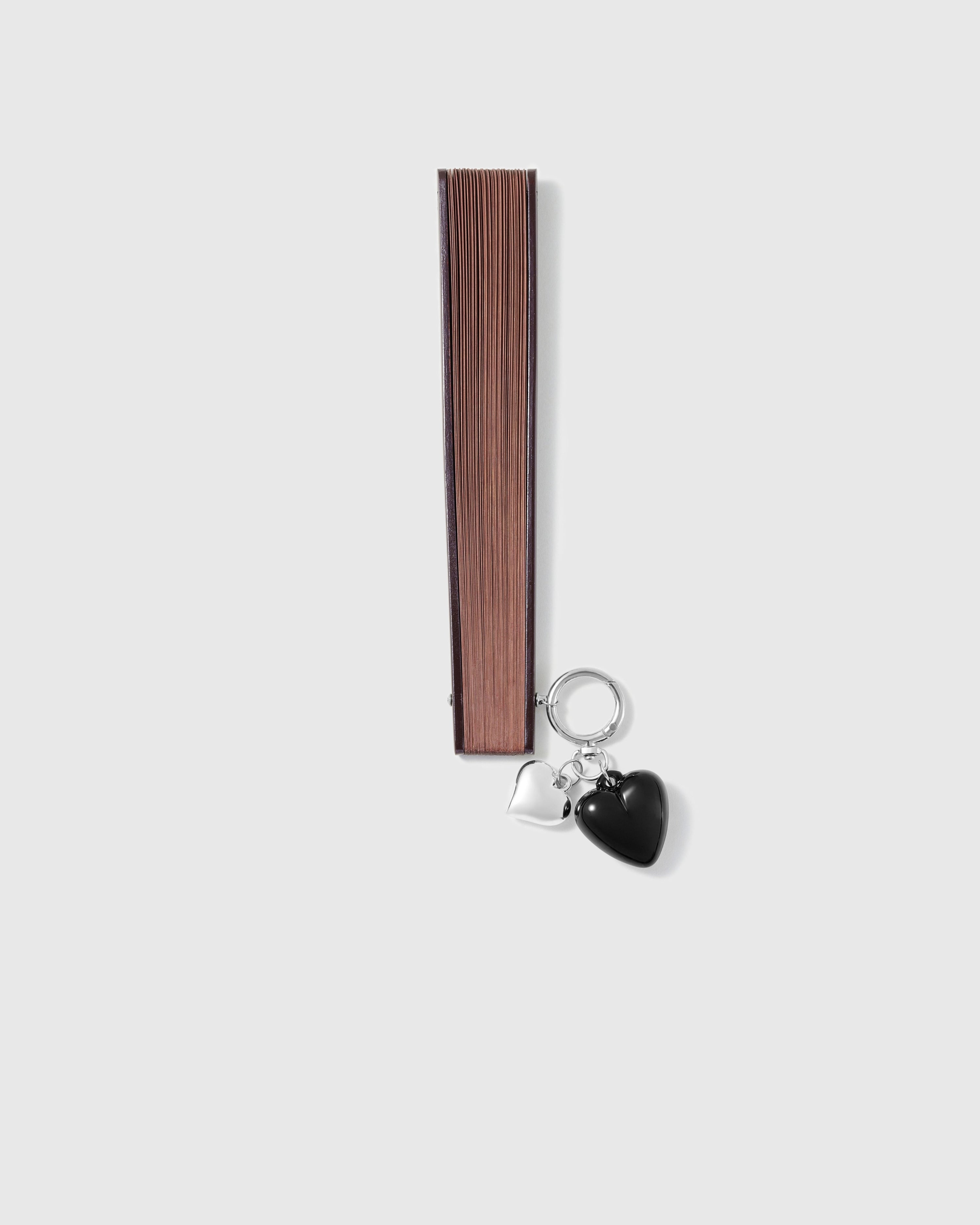 Closed chestnut STICKYZOO all-bamboo hand fan with double-heart charm