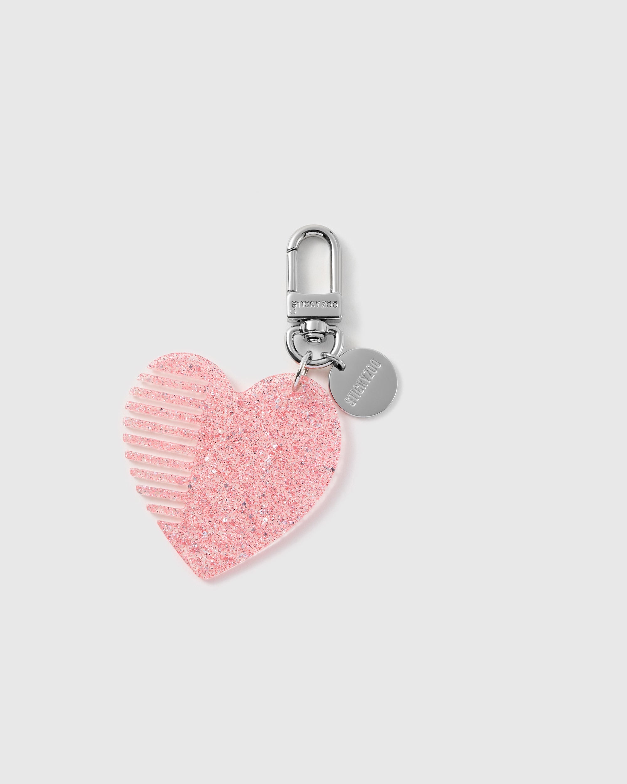 STICKYZOO glitter heart comb charm in Pink with fine built-in teeth, translucent glitter finish and silver-tone hardware.
