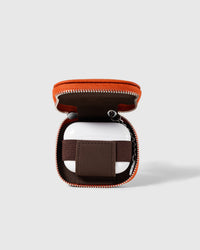 Orange STICKYZOO Zip Clip AirPods Case open with interior elastic band visible