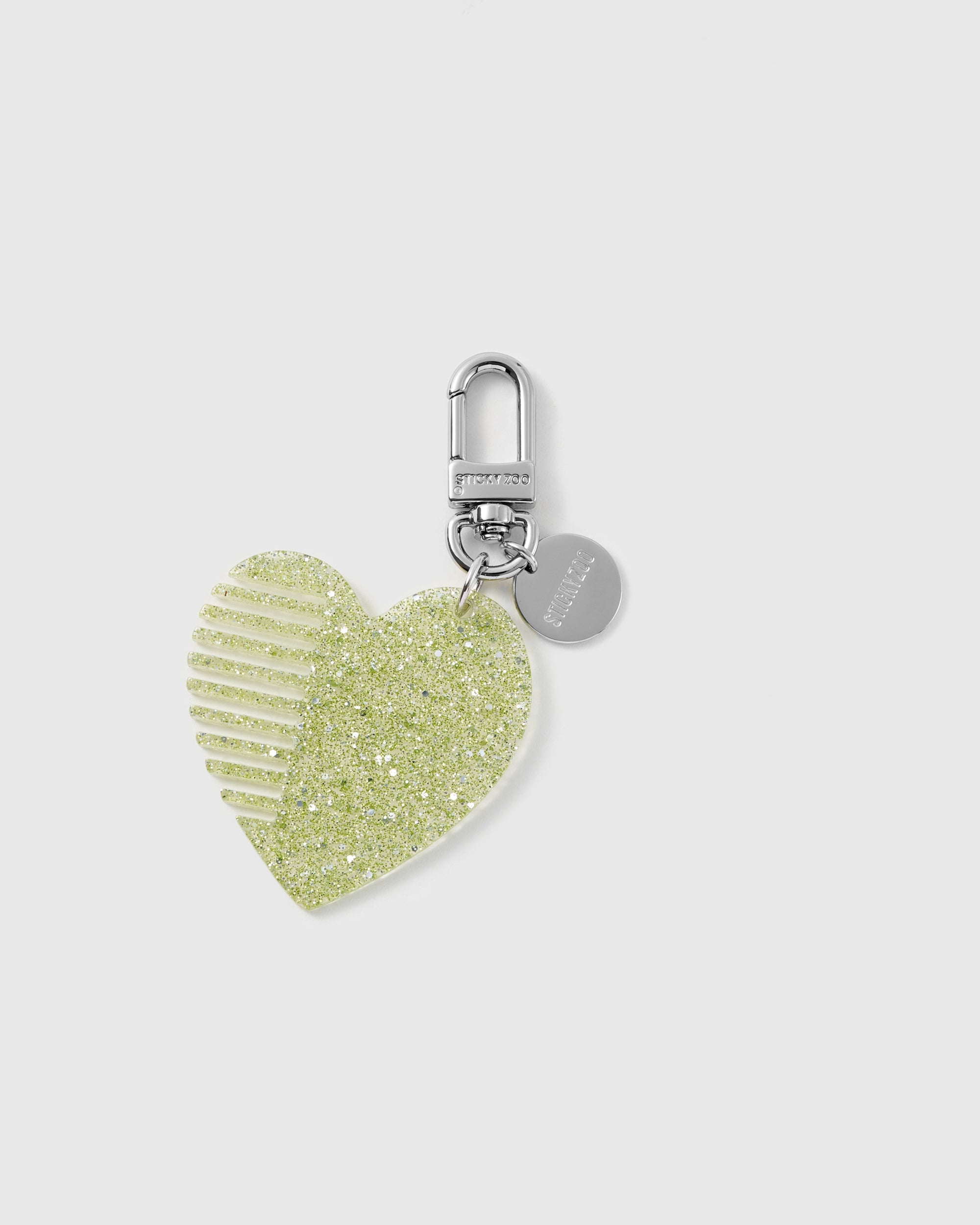 STICKYZOO glitter heart comb charm in Green with fine built-in teeth, translucent glitter finish and silver-tone hardware.