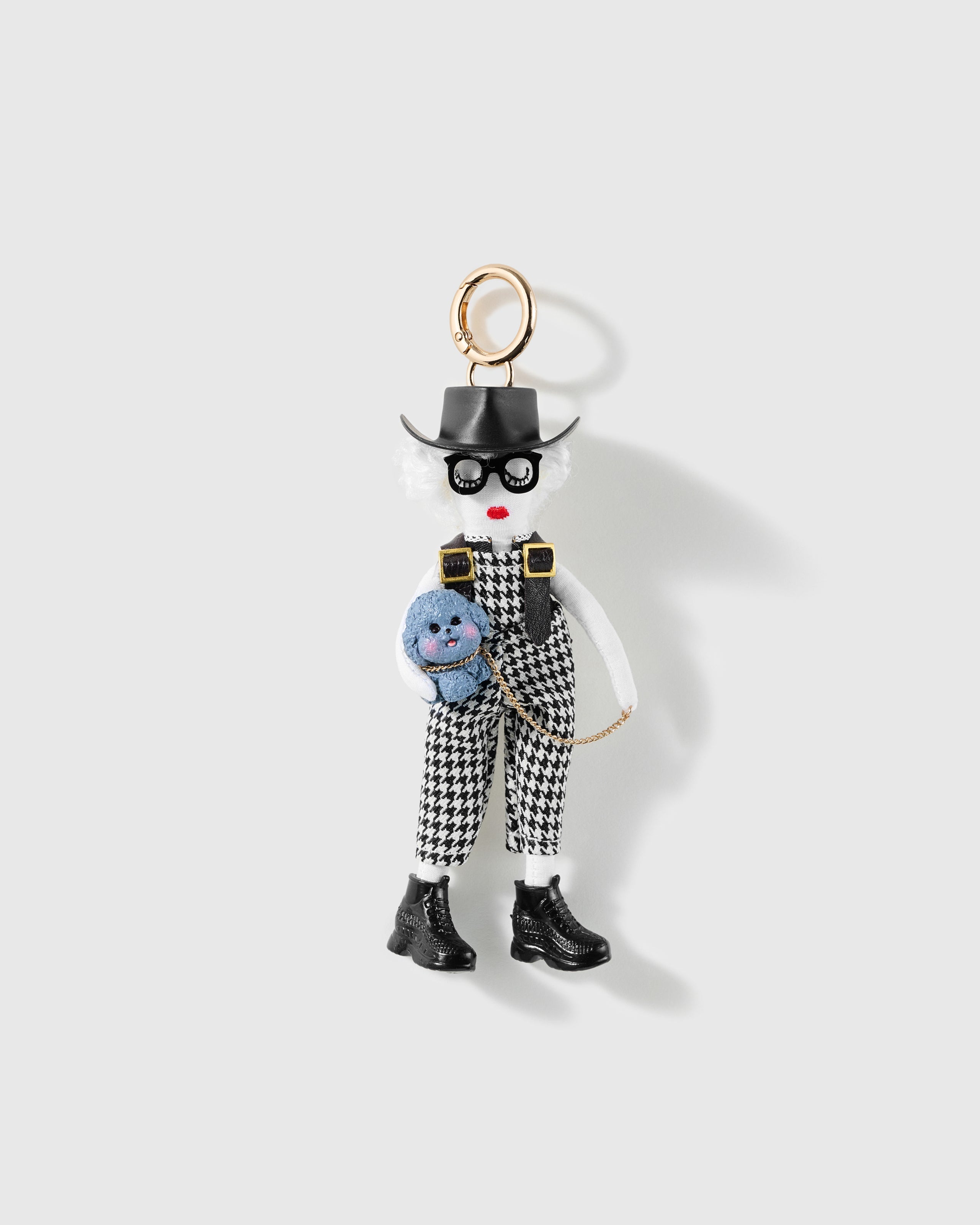 Nerd Mode Blue Teddy Charm, textile character with black hat, glasses, houndstooth outfit and blue teddy, on a light background