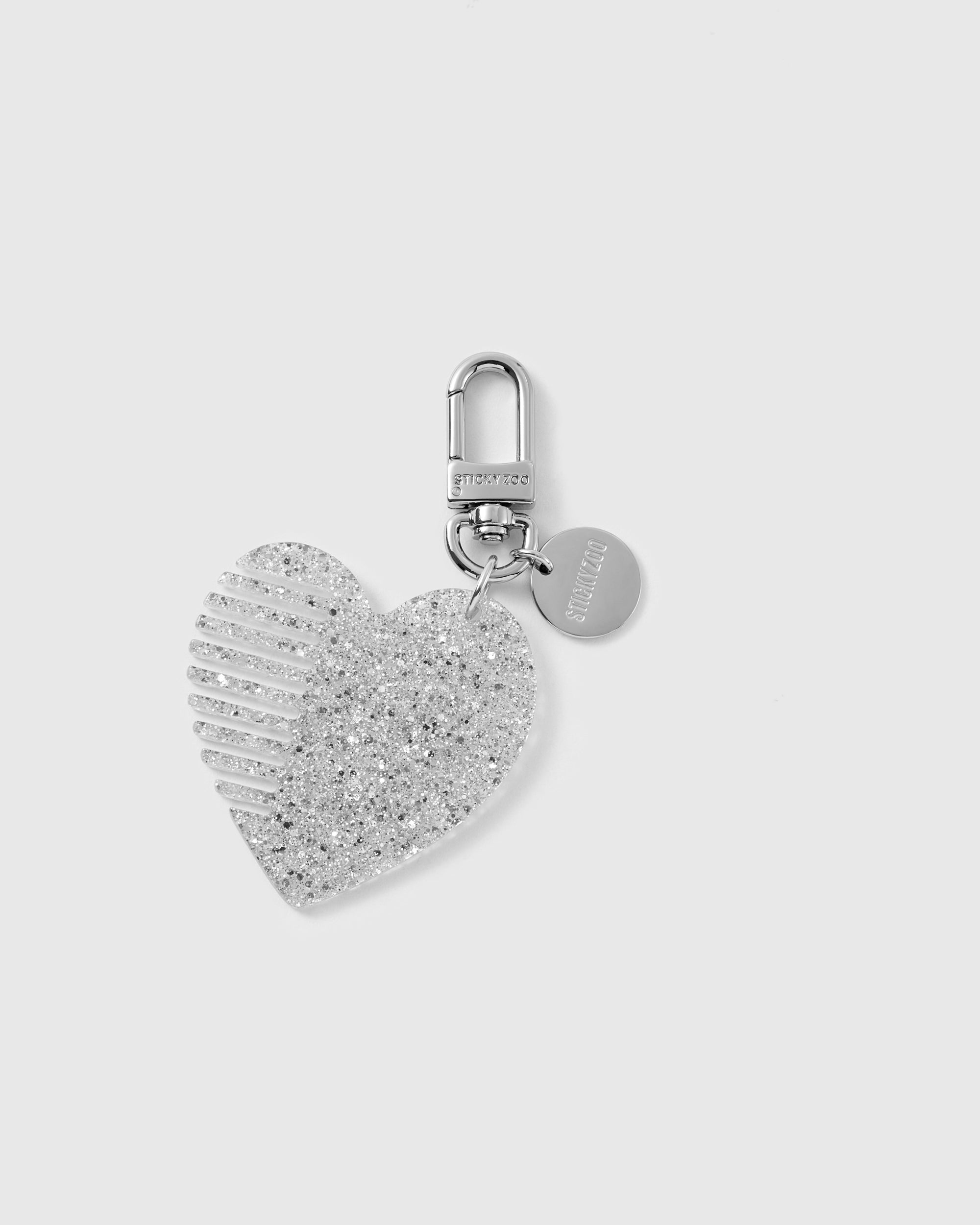 STICKYZOO glitter heart comb charm in Silver with fine built-in teeth, translucent glitter finish and silver-tone hardware.