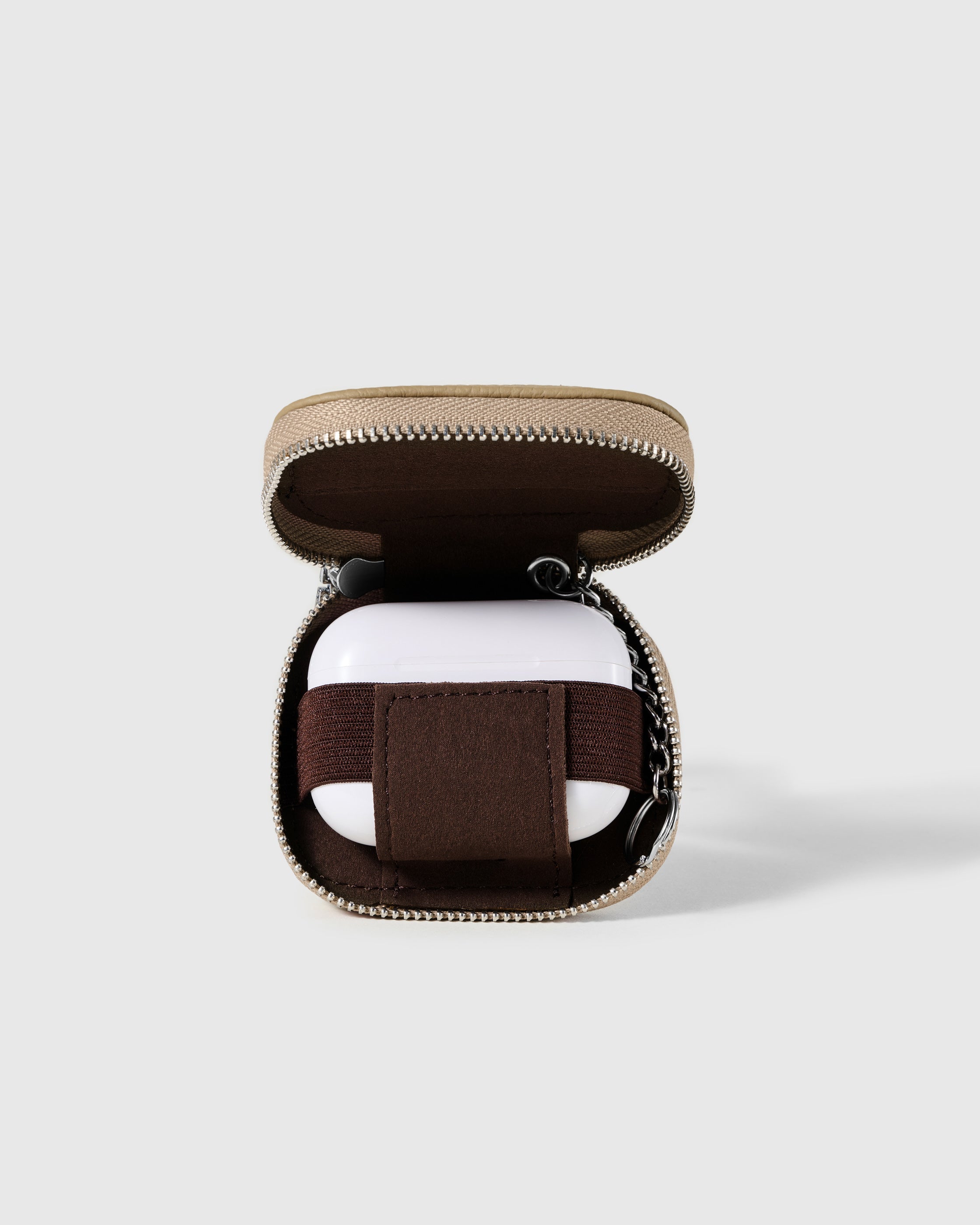 Sand STICKYZOO Zip Clip AirPods Case open with interior elastic band visible