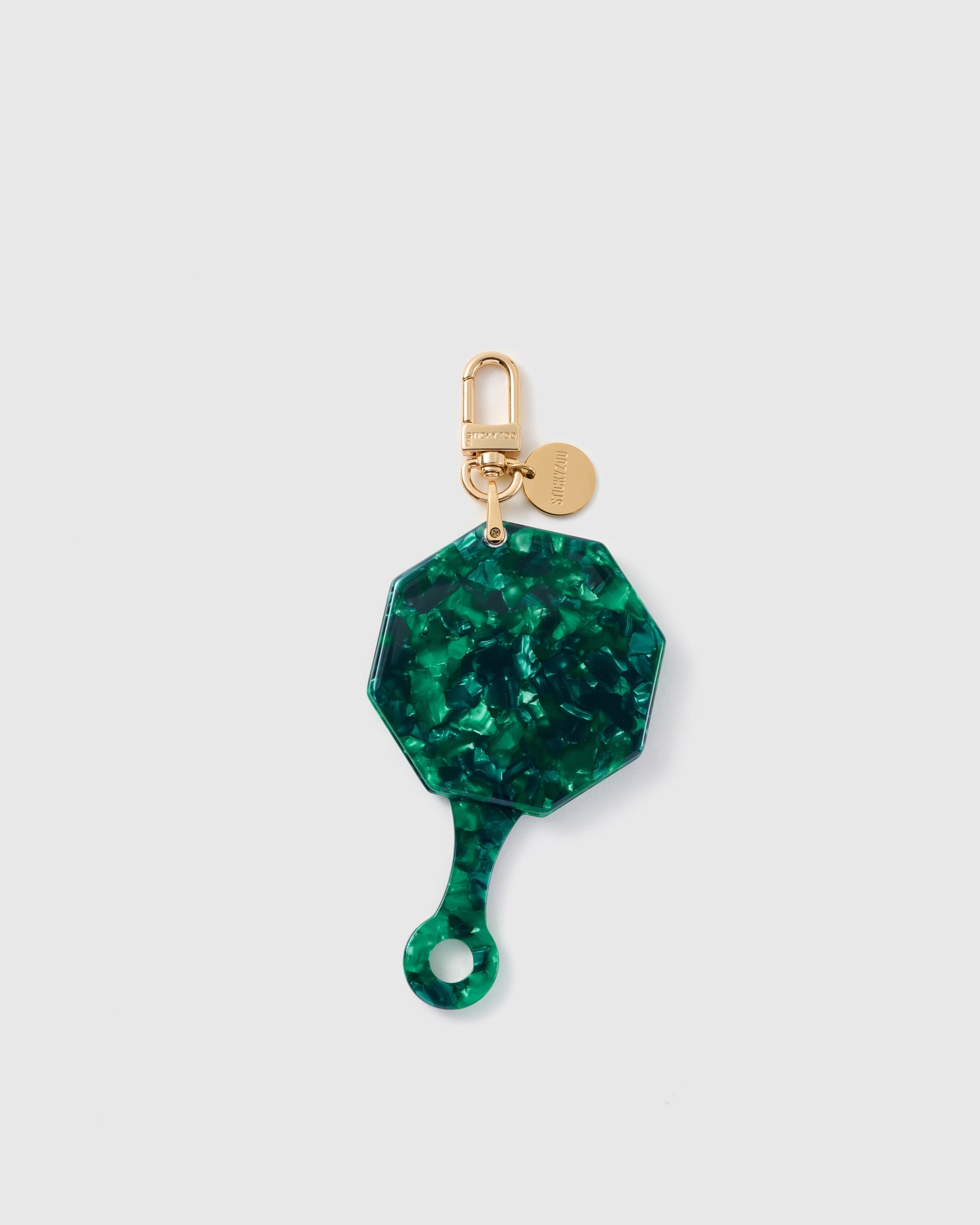 STICKYZOO folding octagonal mirror charm in Green with mosaic-style surface, gold-tone linework and branded clasp.