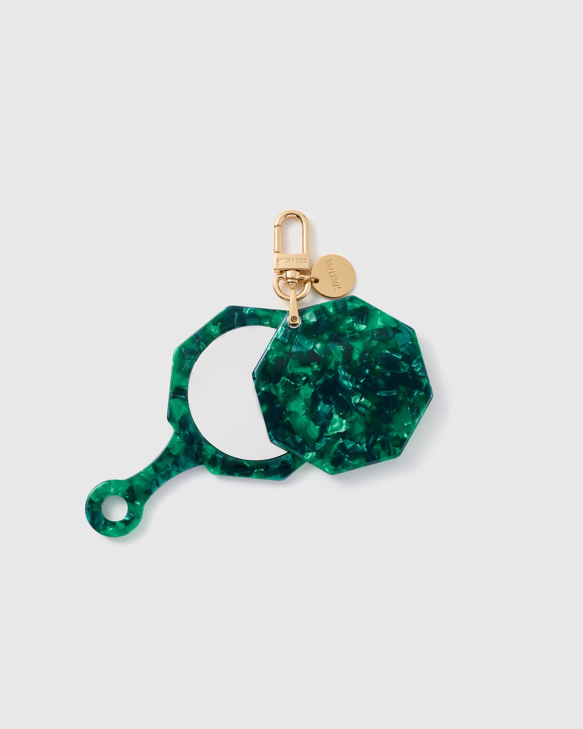 STICKYZOO Daphne Moss Mosaic Mirror Charm open to reveal the compact mirror beneath its green patterned cover.