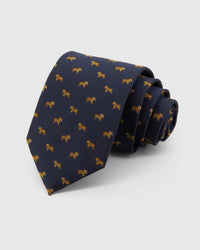 STICKYZOO Midnight Golden Tiger Tie in midnight navy silk, rolled to show midnight ground with compact golden tiger motifs across the blade.