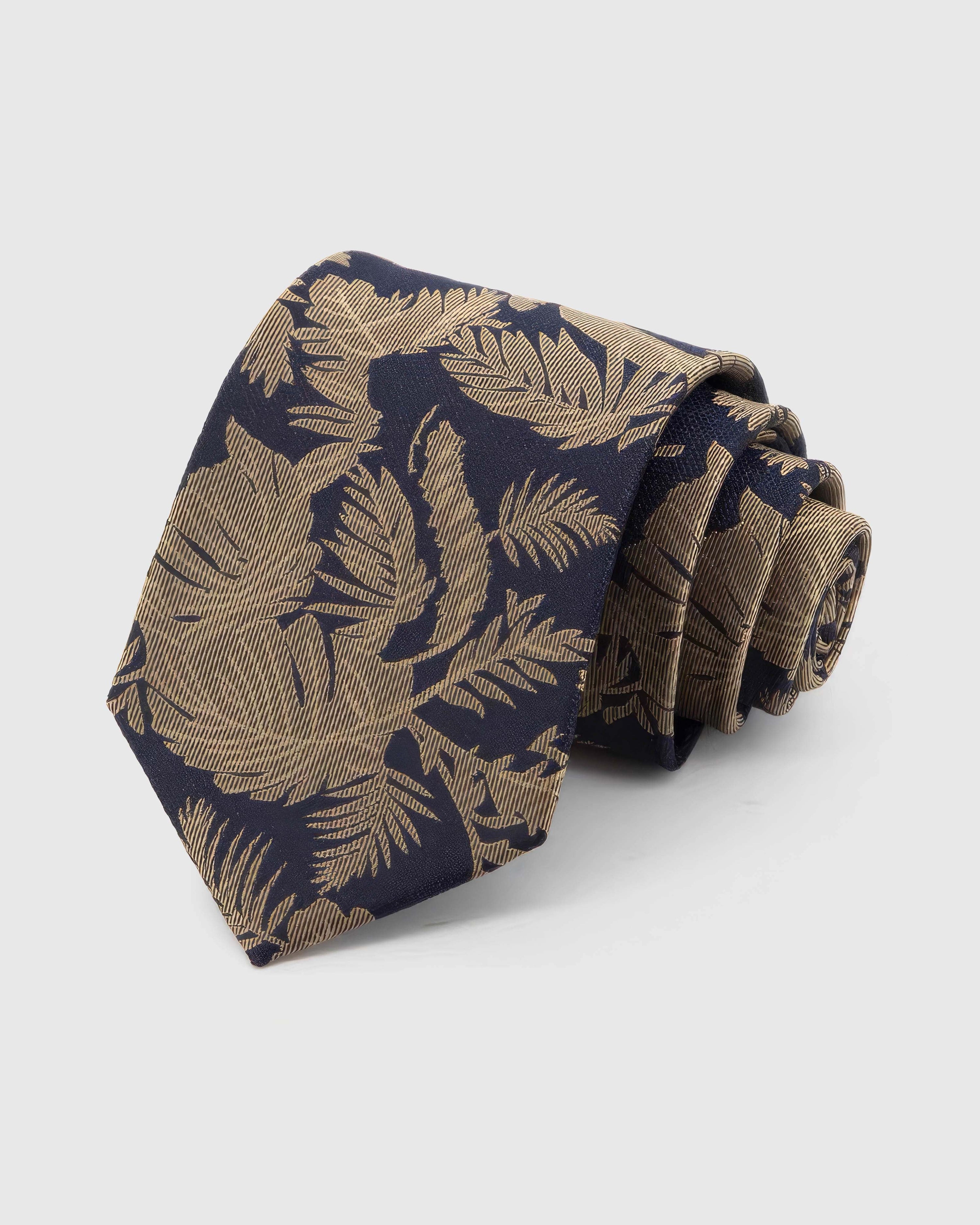 STICKYZOO Navy Gilt Foliage Tie in 100% mulberry silk, with oversized gilt leaves layered across navy silk