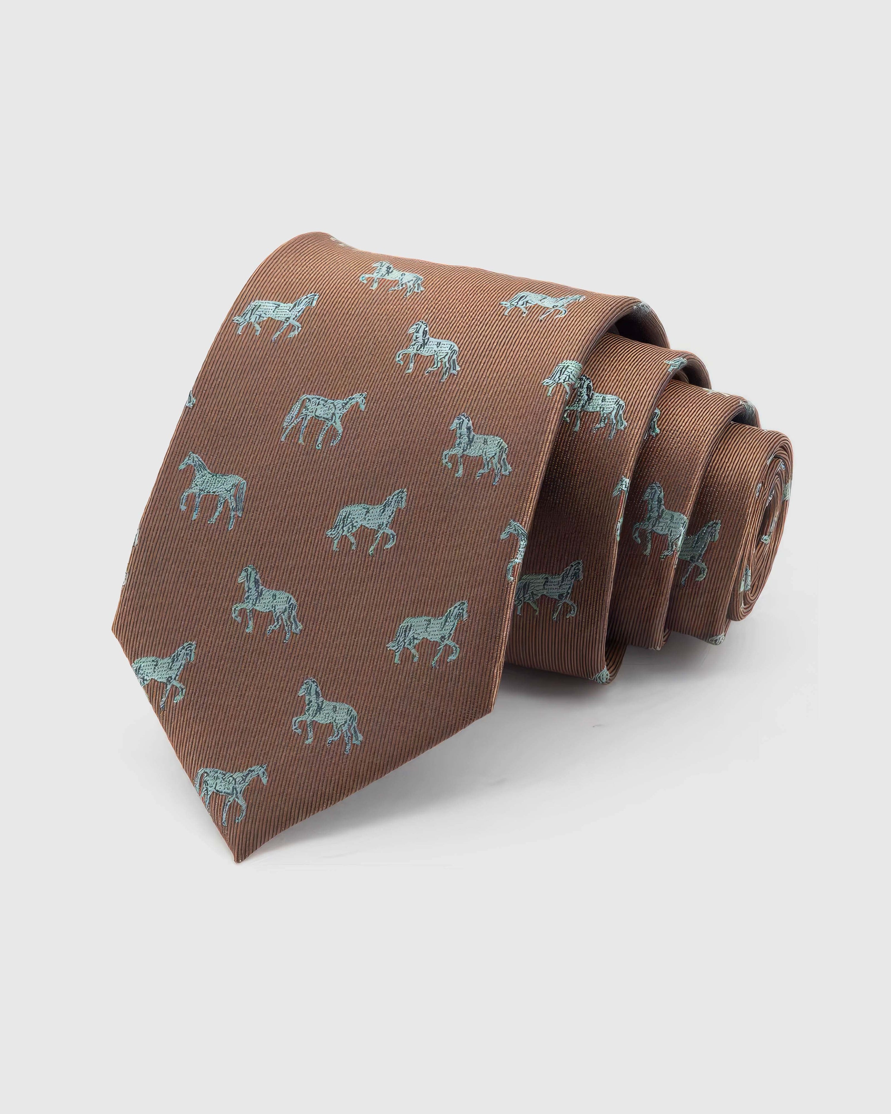 STICKYZOO Chestnut Horse Tie rolled on white, showing mixed horse illustrations across 100% mulberry silk in chestnut brown