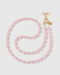 Full-length STICKYZOO cross-body phone strap strung with high-gloss baby-pink resin nugget beads with a soft blush swirl