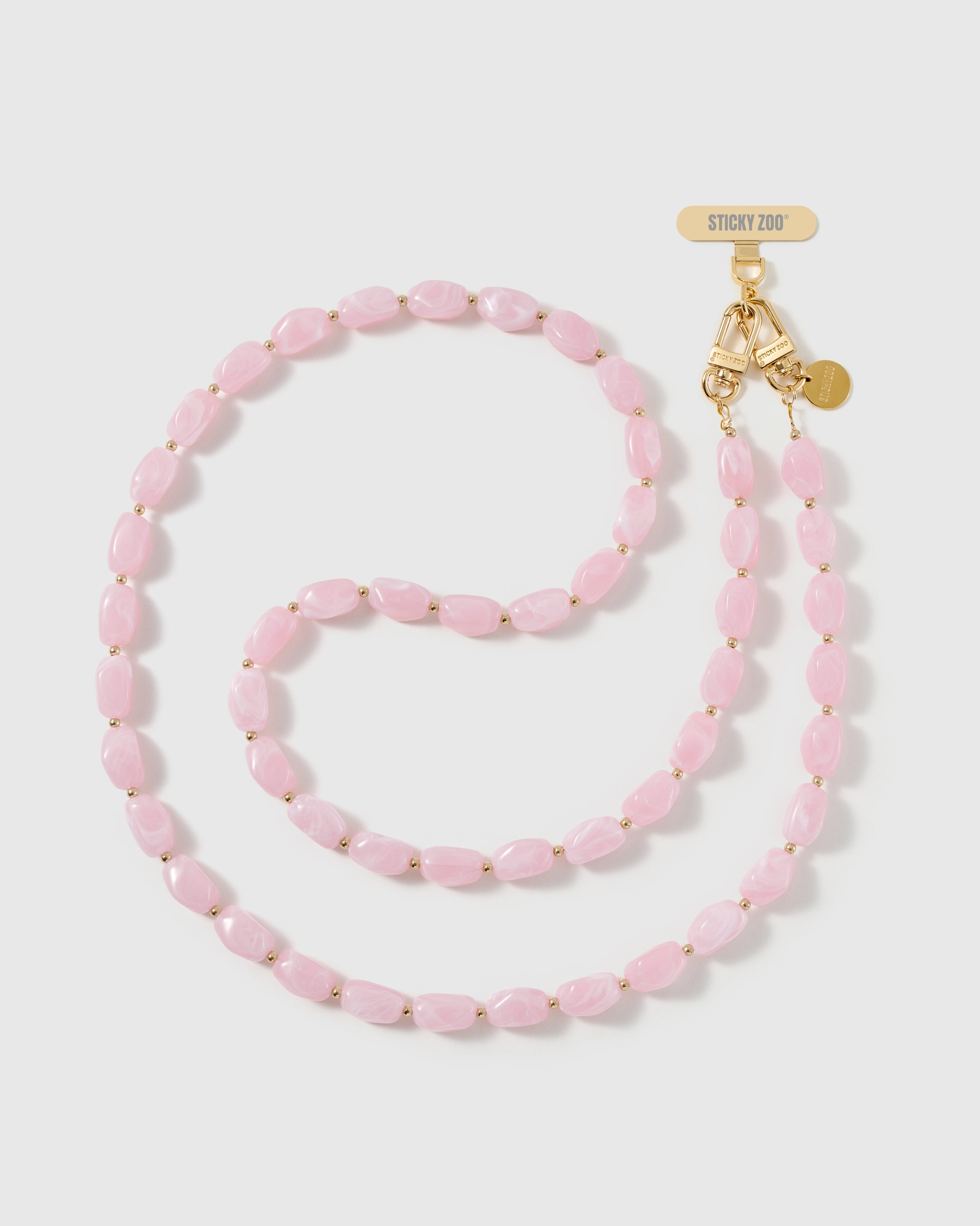 Full-length STICKYZOO cross-body phone strap strung with high-gloss baby-pink resin nugget beads with a soft blush swirl