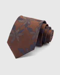 STICKYZOO Caramel Botanical Bloom Tie in 100% mulberry silk, with large midnight botanical blooms opening over caramel silk