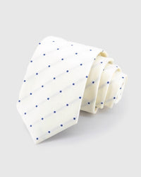 STICKYZOO Ivory Navy Square Tie in ivory silk, rolled to show ivory ground with spaced navy squares and tonal lines across the blade.