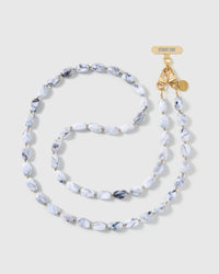 Full-length STICKYZOO cross-body phone strap strung with high-gloss white resin nugget beads with soft grey marbling