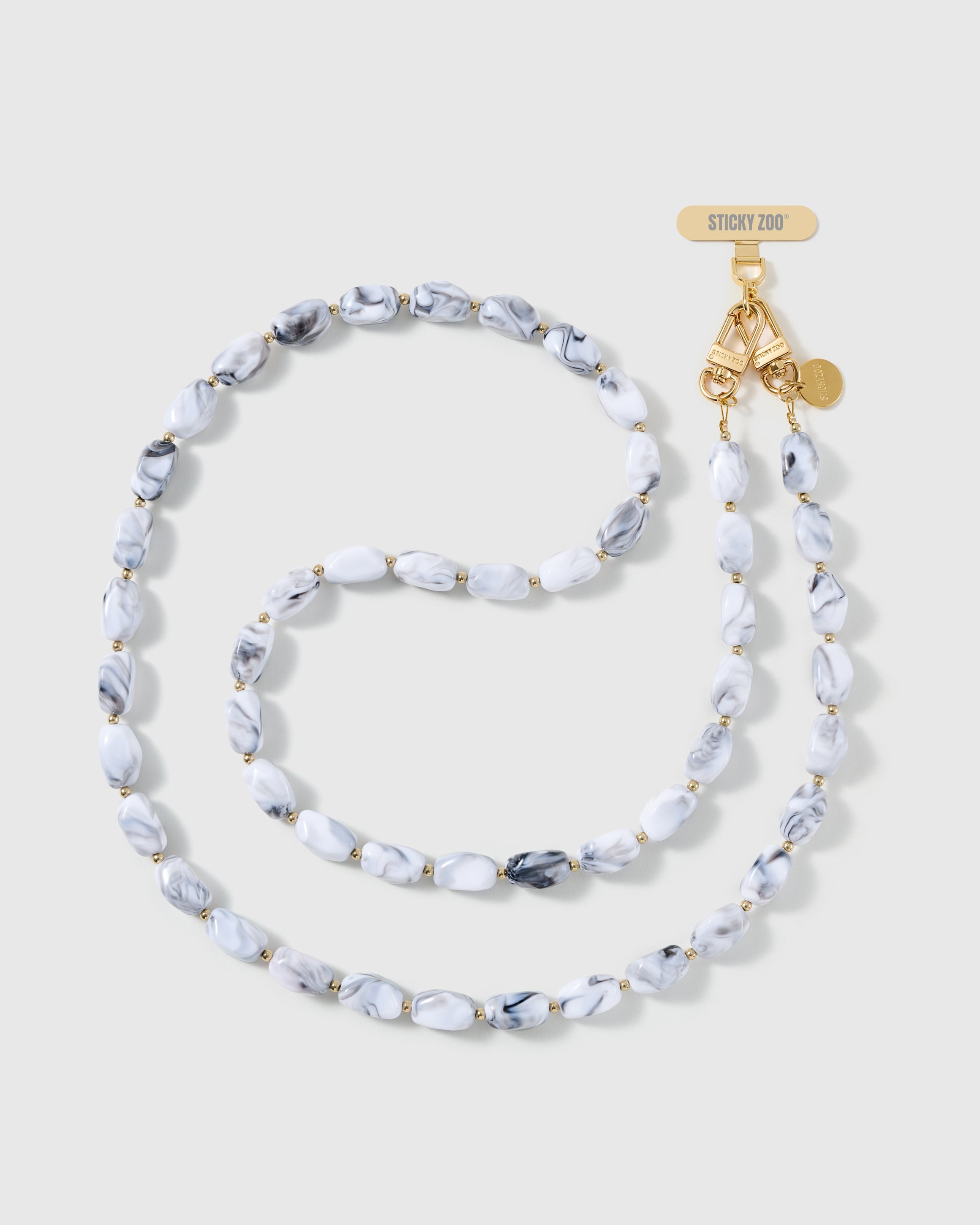 Full-length STICKYZOO cross-body phone strap strung with high-gloss white resin nugget beads with soft grey marbling