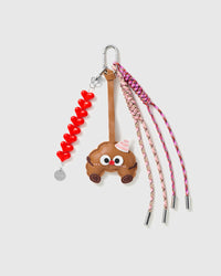 Sweet Ride Heart Stack Charm with a smiling car, linked red hearts and pink braided cords on a light background