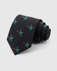 STICKYZOO Noir Crane Tie in noir silk, rolled to show noir ground with colourful flying cranes across the blade.