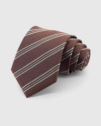 STICKYZOO Mahogany Regimental Tie rolled on white, showing clustered diagonal regimental stripes across 100% mulberry silk in mahogany brown