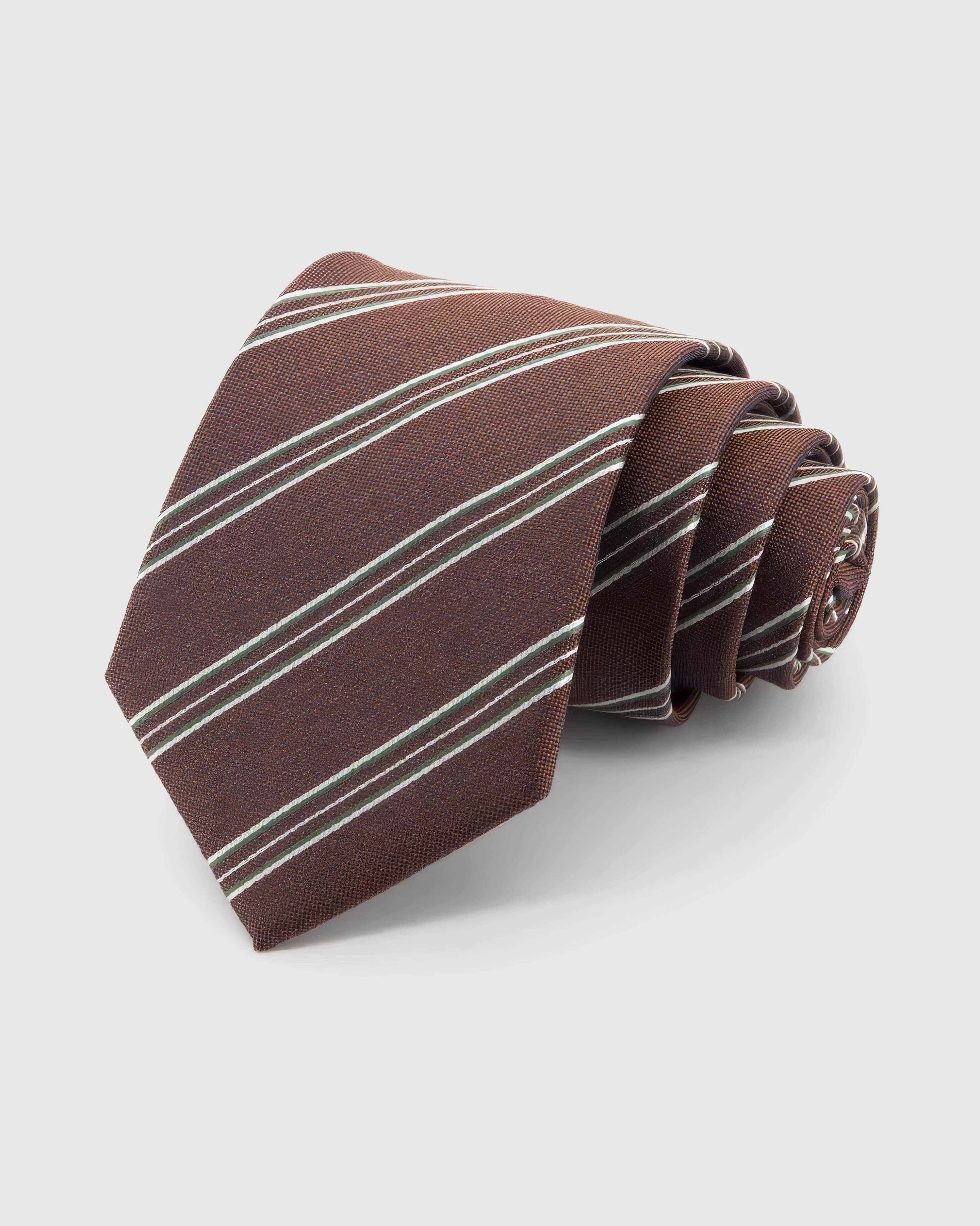 STICKYZOO Mahogany Regimental Tie rolled on white, showing clustered diagonal regimental stripes across 100% mulberry silk in mahogany brown