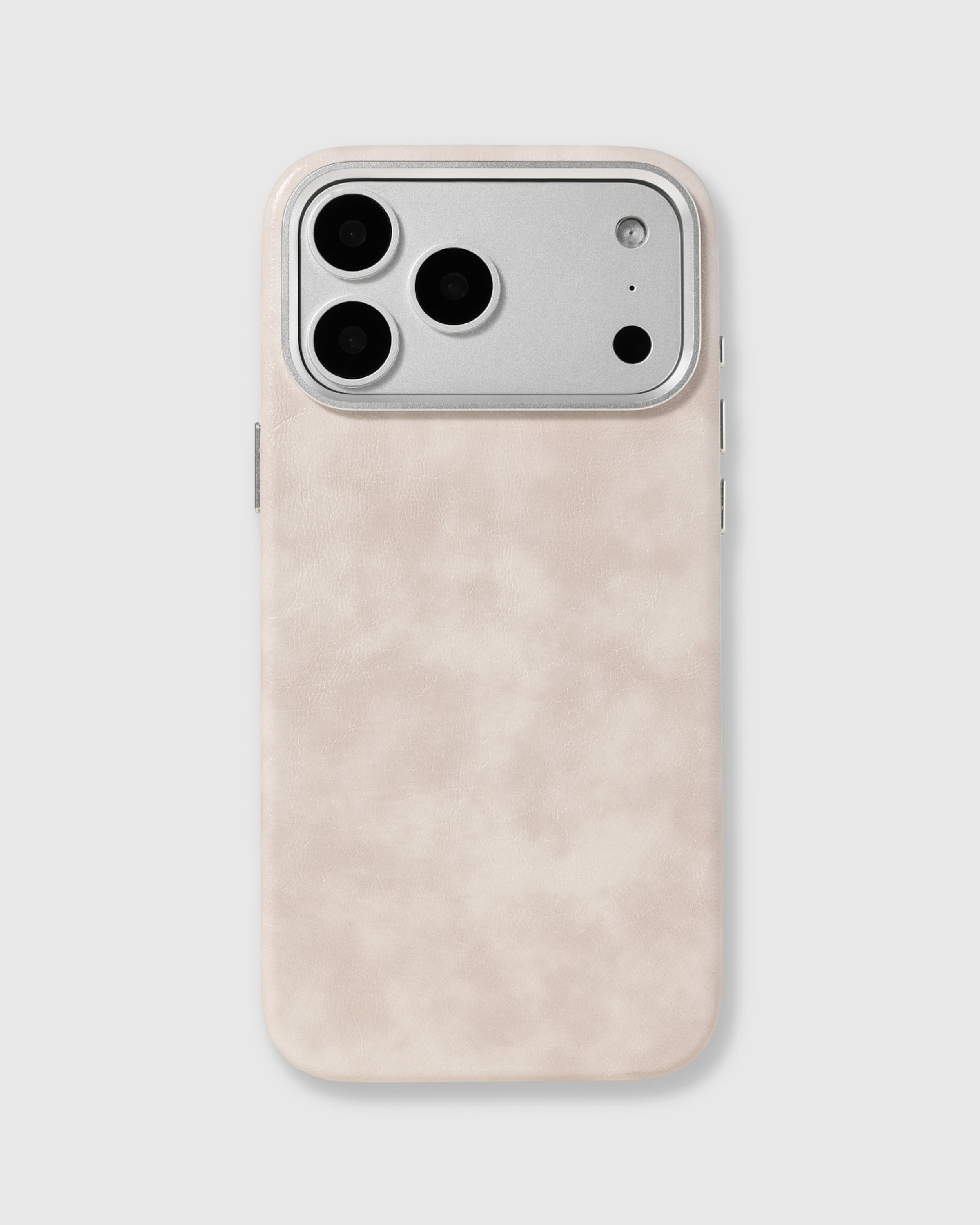 Cream Heritage Leather Case with a pale ivory-cream textured vegan leather surface and raised metal camera edge