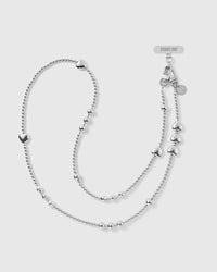 STICKYZOO silver-tone cross-body phone strap with ball beads, graduated clusters, puffy hearts, dual clasps and an engraved disc.