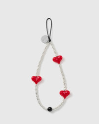 STICKYZOO Scarlet Heart phone strap with three glossy red hearts, silver-tone seed beads, one black bead and a black cord loop.