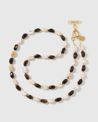 Full-length STICKYZOO cross-body phone strap strung with high-gloss resin nugget beads in tortoiseshell brown and cream