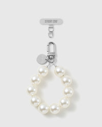 Handmade white pearl-style beaded phone strap by STICKYZOO with silver-tone engraved hardware