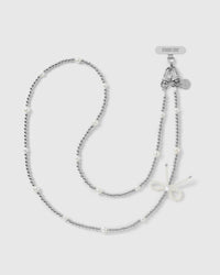 STICKYZOO silver-tone cross-body phone strap with ball beads, rounded faux-pearls, a faux-pearl bow, dual clasps and engraved disc.