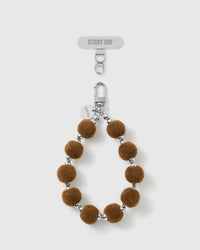 Handmade hazelnut velvet pom bead phone strap by STICKYZOO with silver-tone engraved hardware