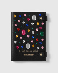 STICKYZOO Gemstone Notebook in black genuine goatskin leather with raised multicolored gem details and two snap straps