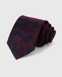 STICKYZOO Claret Shadow Bloom Tie in 100% mulberry silk, with large midnight floral silhouettes spreading over claret silk