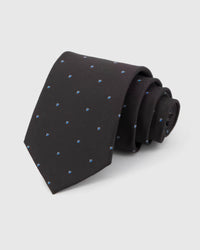 STICKYZOO Noir Blue Icon Tie in noir silk, rolled to show noir ground with small cobalt, azure and white abstract icons across the blade.