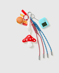Burger Mushroom Arcade Stack Charm with a red mushroom, burger motif, blue handheld-game piece and blue-and-red cords on a light background