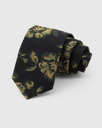 STICKYZOO Noir Golden Rose Tie rolled on white, showing a noir ground with large golden roses and deep-green botanical leaves across the front blade.