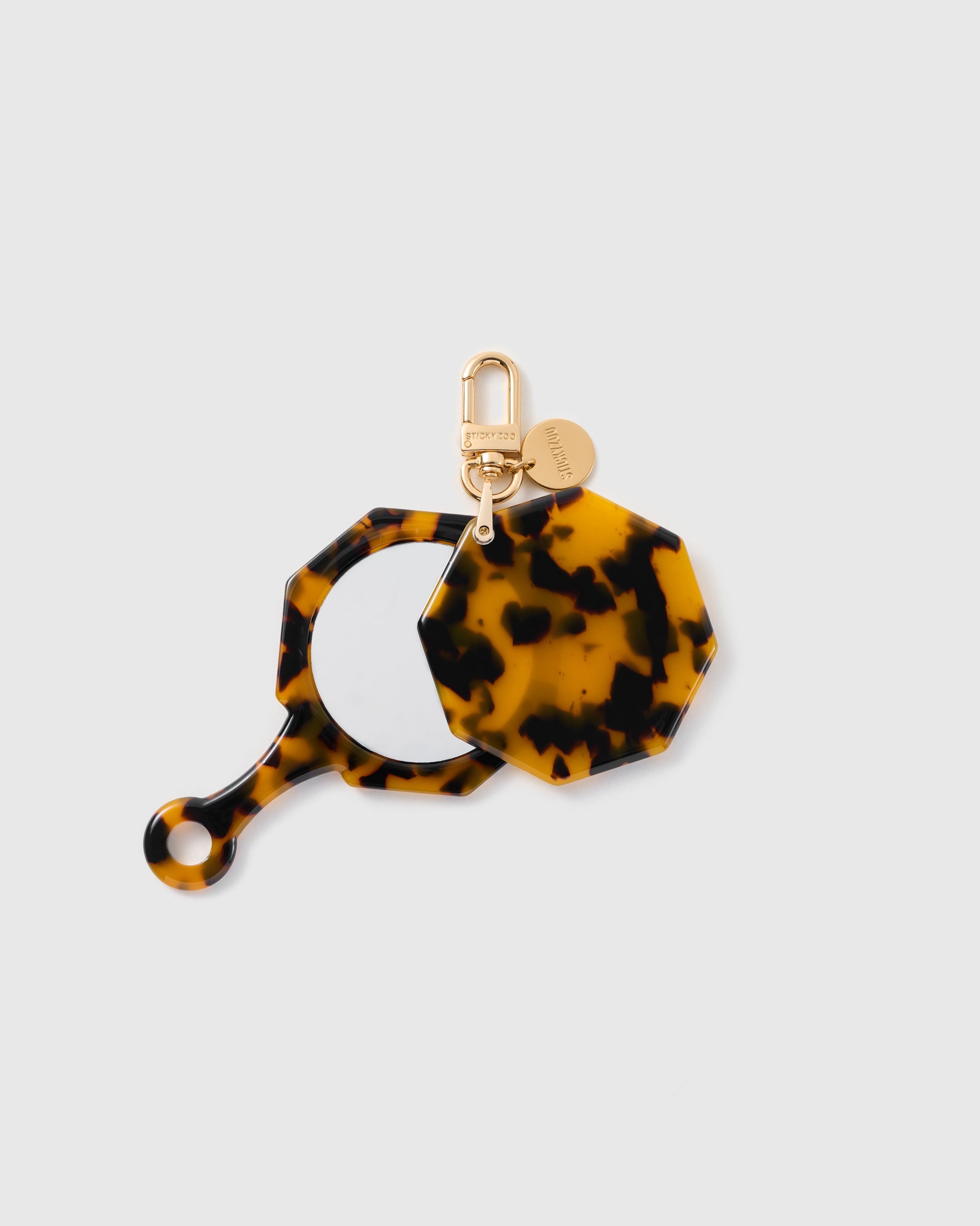 STICKYZOO Carmen Espresso Mosaic Mirror Charm open to reveal the compact mirror beneath its brown patterned cover.