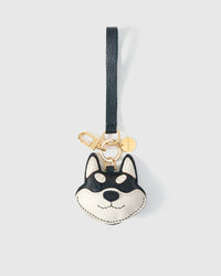 Wear the black Tokyo Shiba charm on a bag with the leather strap loop, or clip it to keys with the 18K gold-plated keychain clip.