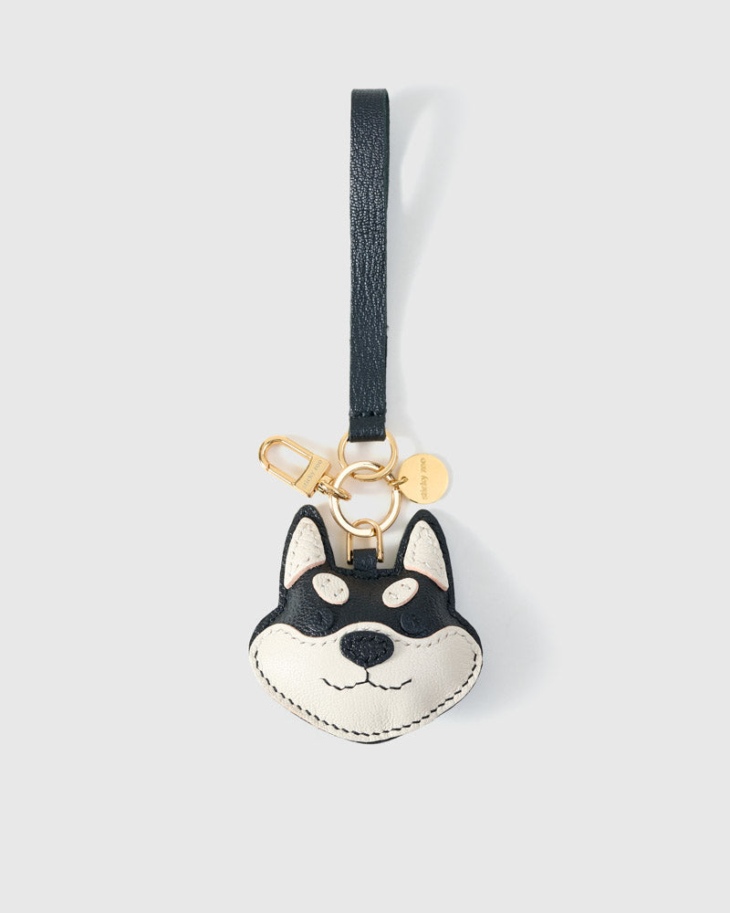 Wear the black Tokyo Shiba charm on a bag with the leather strap loop, or clip it to keys with the 18K gold-plated keychain clip.