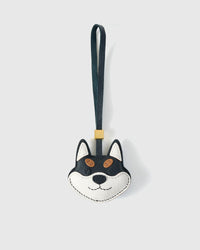 Black-And-Orange Tokyo Shiba charm handmade from French Alran genuine goatskin and French suede — real full-grain leather from Tarn, since 1903. 3 days of hand-cutting, hand-stitching, hand-layering. Arrives in luxury gift packaging. Designed in Amsterdam.