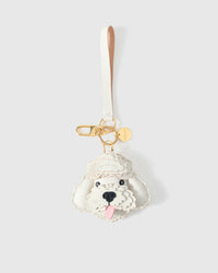Poodle leather bag charm in both attachment formats — leather strap with engraved 18K gold cube and 18K gold-plated keychain clip. Handmade French Alran goatskin.