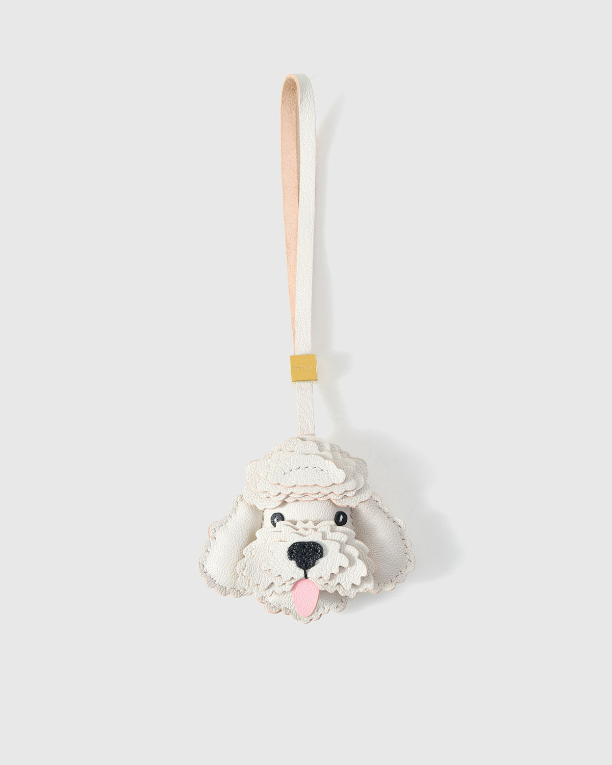 Handmade Poodle leather bag charm — full-grain French Alran goatskin with visible hand-stitched edges. STICKYZOO Amsterdam design.