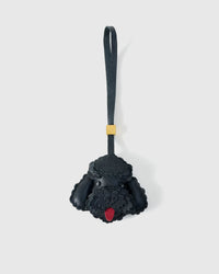 Handmade Poodle leather bag charm by STICKYZOO — hand-cut, hand-stitched, hand-layered French Alran goatskin over 3 days in black. Designed in Amsterdam.