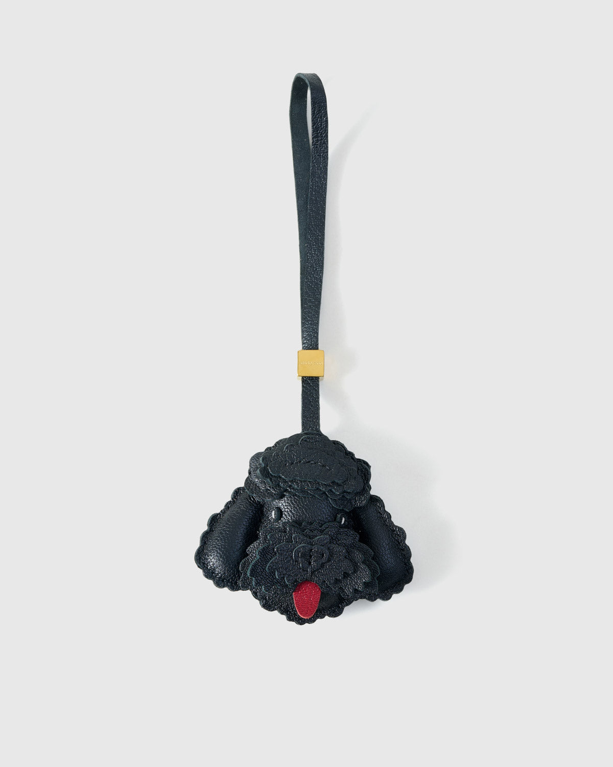 Handmade Poodle leather bag charm by STICKYZOO — hand-cut, hand-stitched, hand-layered French Alran goatskin over 3 days in black. Designed in Amsterdam.