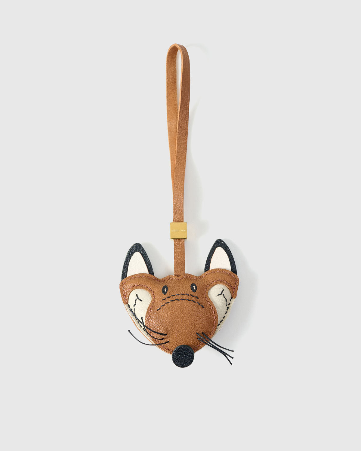 FOX CHARM charm handmade from French Alran genuine goatskin — A fox face with whiskers. Real leather whiskers — thin dark. Three days by hand. Arrives in luxury gift packaging. Designed in Amsterdam.