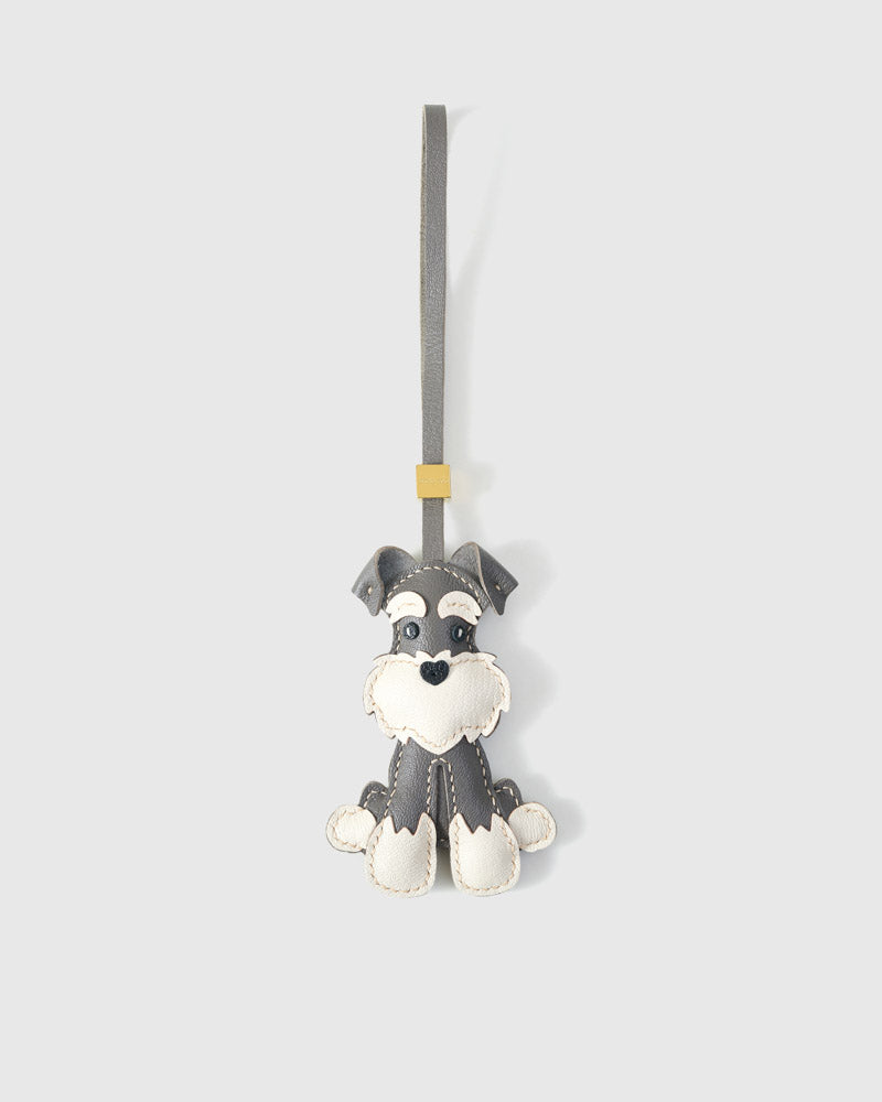 The urban schnauzer charm is made from genuine French Alran goatskin and French suede — real full-grain leather. Never vegan. Never synthetic. The difference shows.