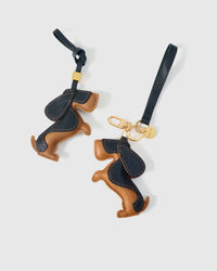 Wear the dachshund charm on a bag with the leather strap loop, or clip it to keys with the 18K gold-plated keychain clip.