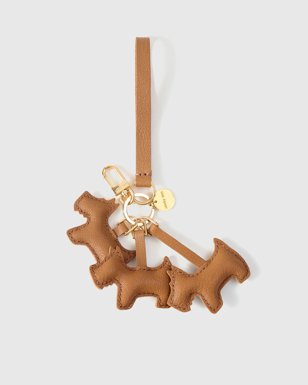 French Alran goatskin develops a natural patina over time. The triple schnauzer charm looks as good after three years as three days.