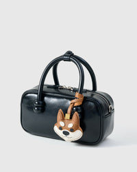 Wear the orange Tokyo Shiba charm on a bag with the leather strap loop, or clip it to keys with the 18K gold-plated keychain clip.
